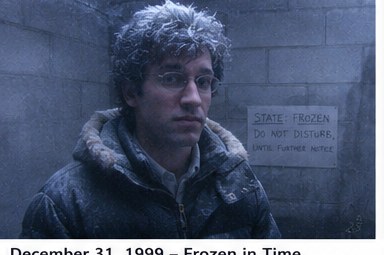 Stan sealed away and frozen, beside a hand-lettered sign